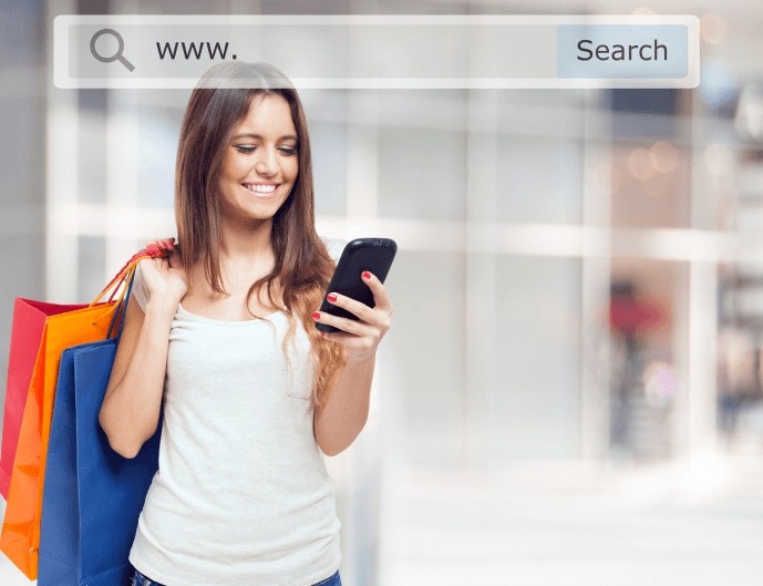 Smiling woman using 1800AutoShop on her phone